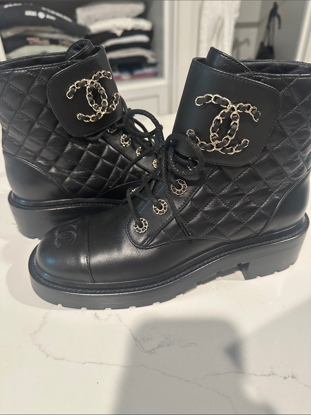 CHANEL Black Quilted Leather Lace-Up Combat Boots with Gold Chain CC
